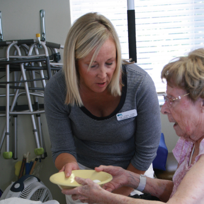 staffer talking to nursing home resident