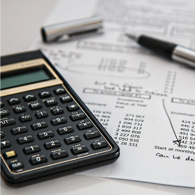 calculator, pen and spreadsheet